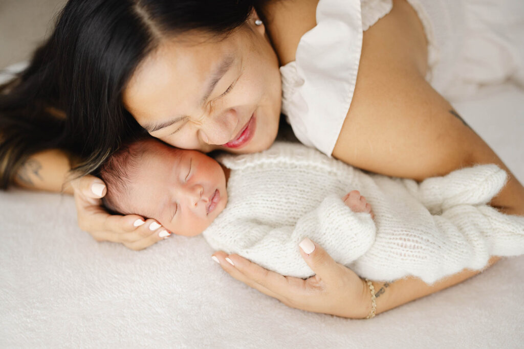 mom cradling newborn baby