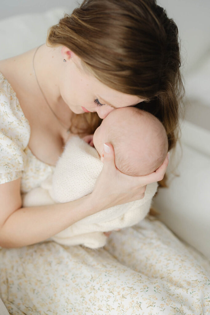 photo of mother holding baby forehead to forehead