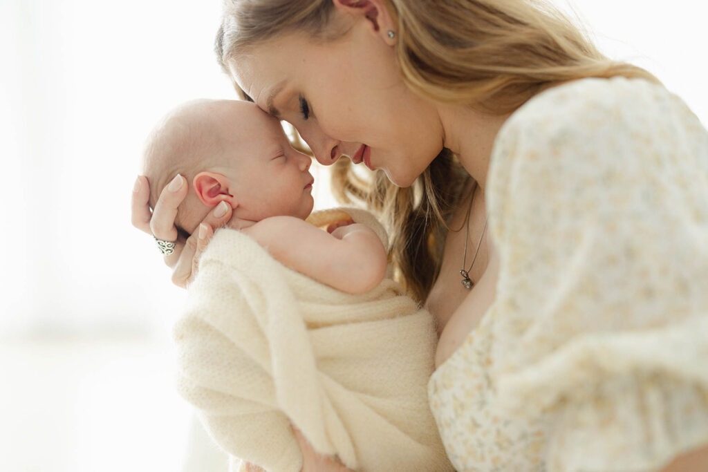 profile photo of mom holding newborn baby