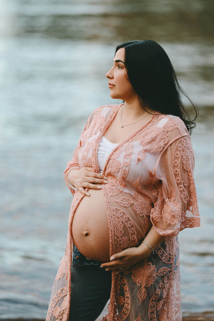 photo of pregnant woman with top that opens in front, exposing her belly