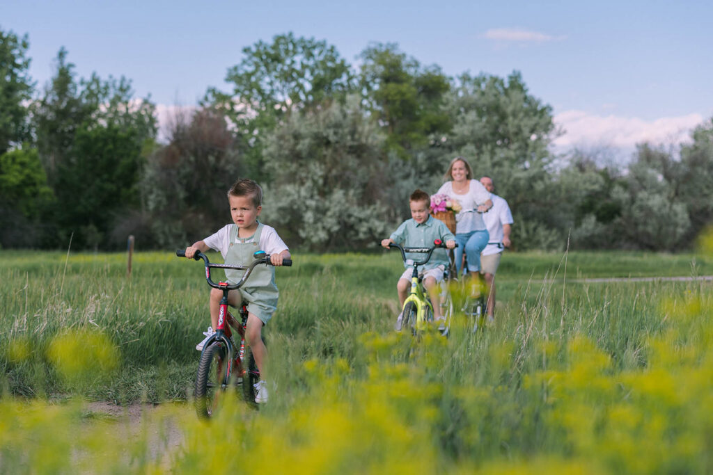 family riding bikes together in summer