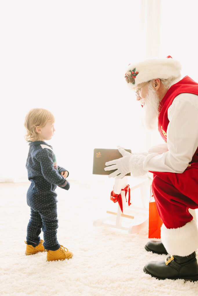 a little boy meeting Santa for the first time